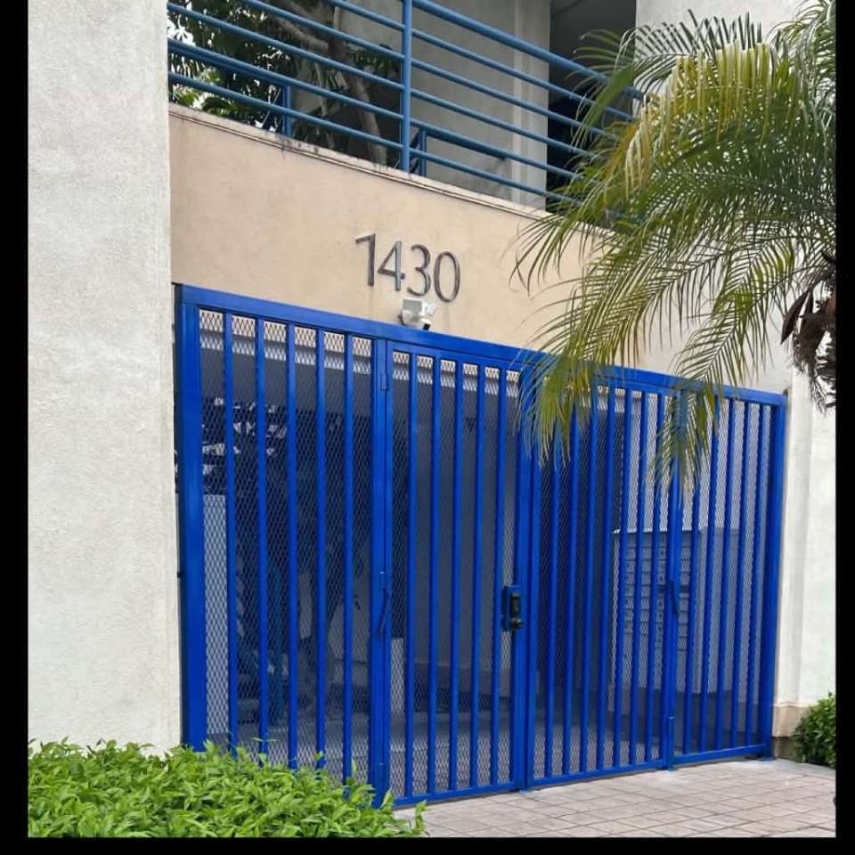 Ground-floor blue gate entry to 1430 E Cooley Dr