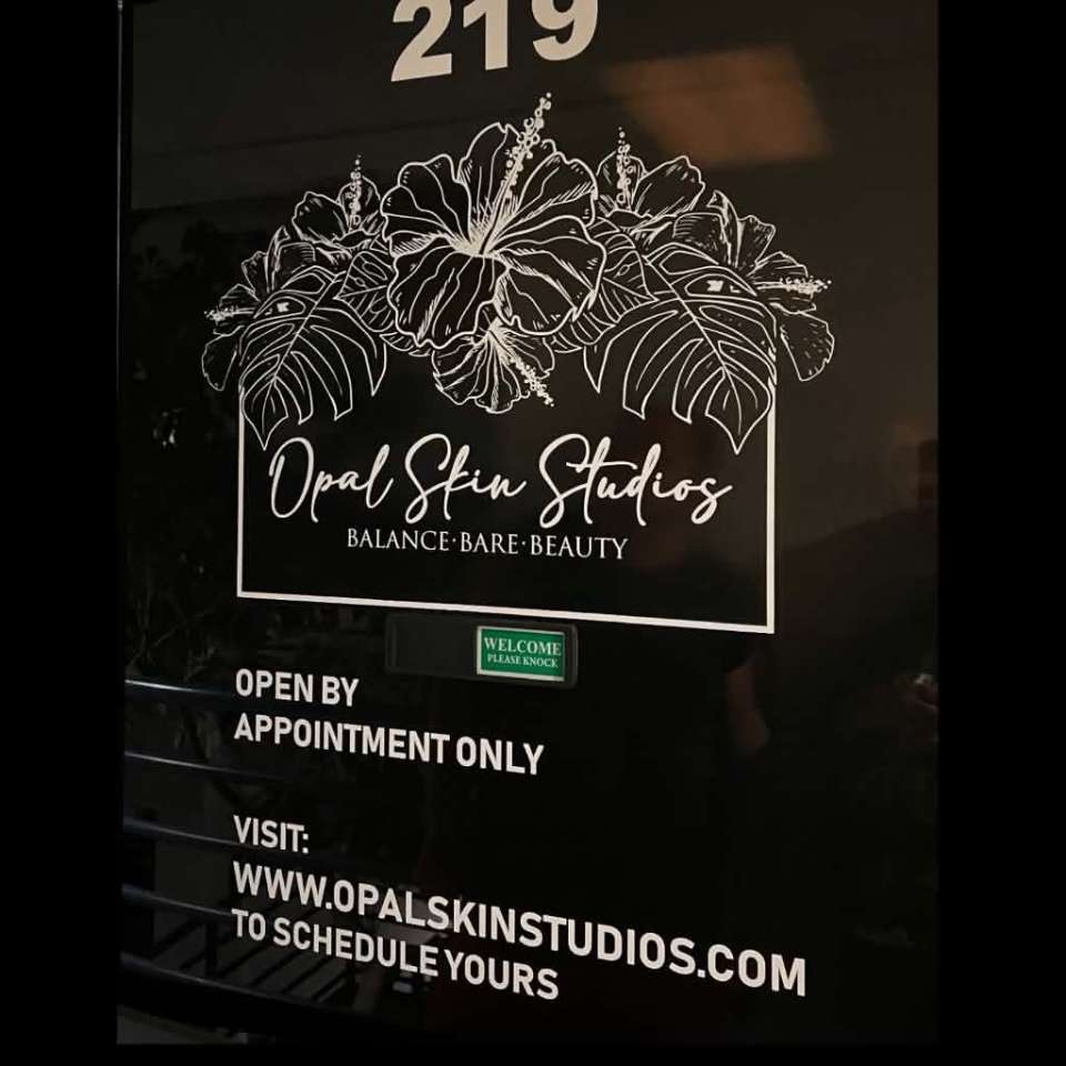 Opal Skin Studios suite 219 door signage — open by appointment